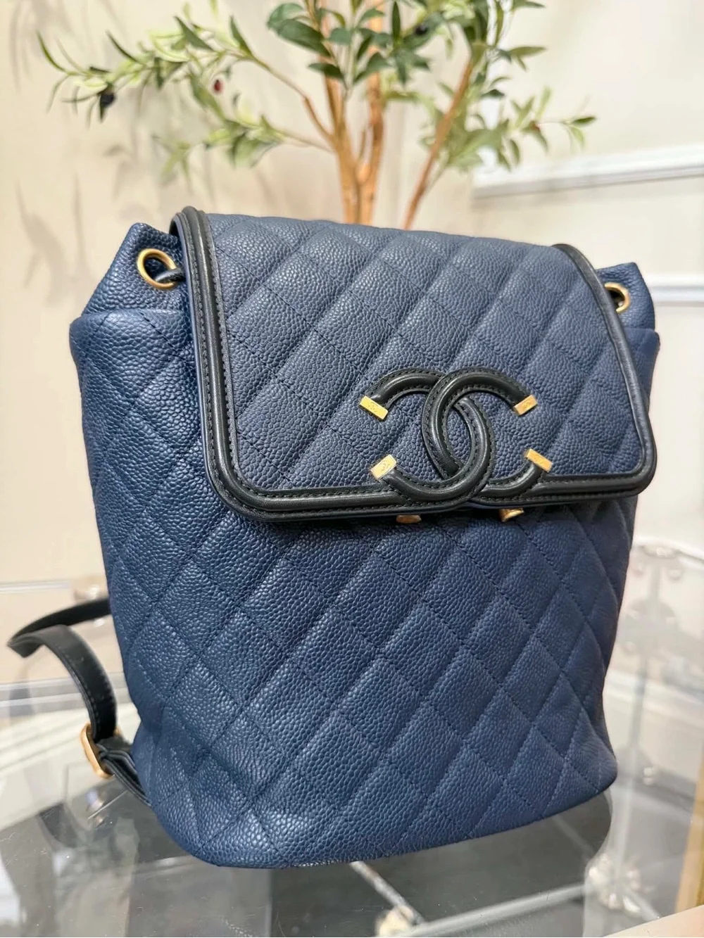 CHANEL Quilted Navy Caviar Leather Backpack with Gold Hardware